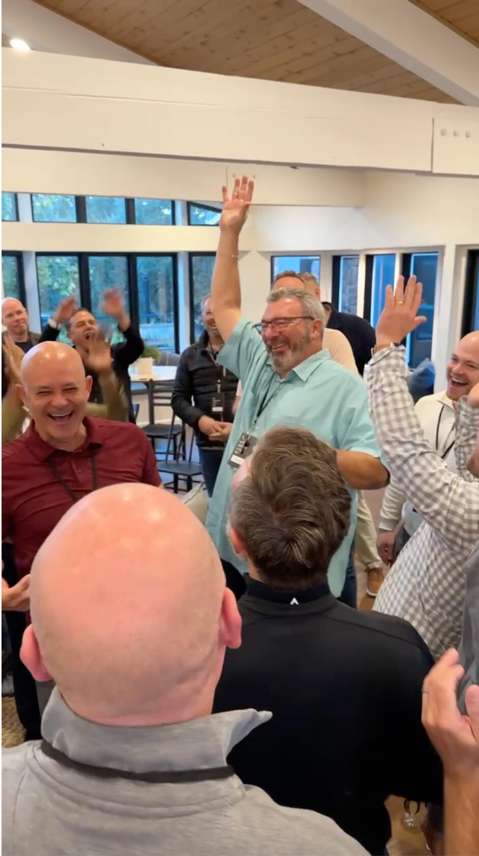Workshop participants dancing with hands up at The Oaks retreat